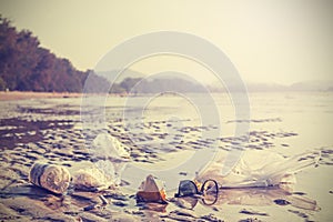 Retro stylized picture of garbage on a beach.