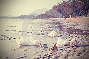 Retro stylized picture of garbage on a beach.