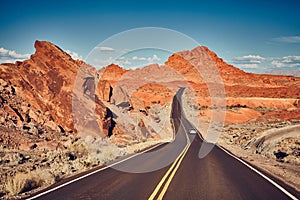 Retro stylized picture of a scenic desert road.