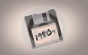 A retro synthwave 1980`s themed old black aged floppy disk illustration background with copy space