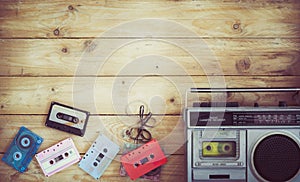 retro technology of radio cassette recorder music with retro tape cassette on wood table