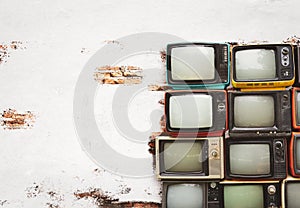 Retro televisions pile photo