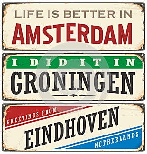 Retro tin sign collection with Netherlands city names