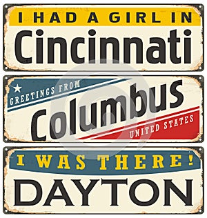 Retro tin sign collection with USA city names