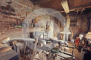 Retro toned old carpenter workshop interior