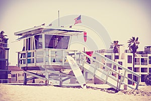 Retro toned picture of a lifeguard tower.