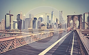 Retro toned picture of New York cityscape seen from the Brooklyn Bridge, USA