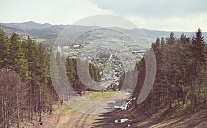 Retro toned picture of Pienin Mountains with town of Szczawnica in distance, Poland