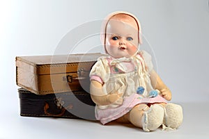 Retro toys, vintage doll and old suitcases