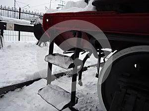 Retro train. Locomotive of the 19th early 20th century with a steam engine. Vintage style. Black train with red wheels. Metal cast