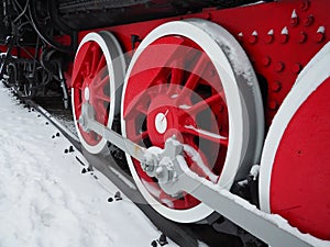 Retro train. Locomotive of the 19th early 20th century with a steam engine. Vintage style. Black train with red wheels. Metal cast