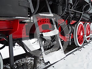 Retro train. Locomotive of the 19th early 20th century with a steam engine. Vintage style. Black train with red wheels. Metal cast