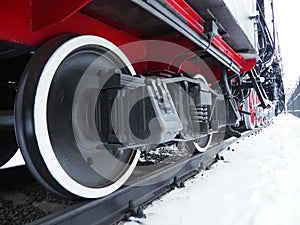 Retro train. Locomotive of the 19th early 20th century with a steam engine. Vintage style. Black train with red wheels. Metal cast