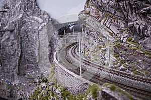 Retro train on a mountain rail landscape