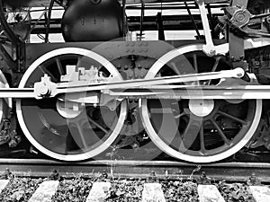 Retro train two wheels. Sleepers and rails, mechanisms, pistons and guides. Locomotive of the 19th early 20th century