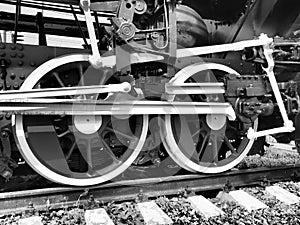 Retro train two wheels. Sleepers and rails, mechanisms, pistons and guides. Locomotive of the 19th early 20th century
