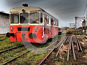 Retro train wagon of red color. Vintage locomotive made in Yugoslavia. Sremska Mitrovica, Serbia. The metal body of a