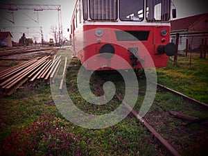 Retro train wagon of red color. Vintage locomotive made in Yugoslavia. Sremska Mitrovica, Serbia. The metal body of a