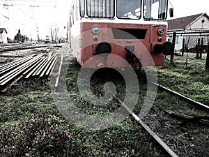 Retro train wagon of red color. Vintage locomotive made in Yugoslavia. Sremska Mitrovica, Serbia. The metal body of a