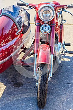 Retro tricar. Three-wheeled motorcycle on city street