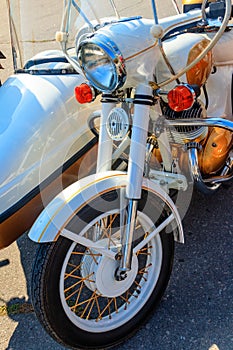 Retro tricar. Three-wheeled motorcycle on city street