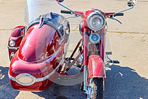 Retro tricar. Three-wheeled motorcycle on city street