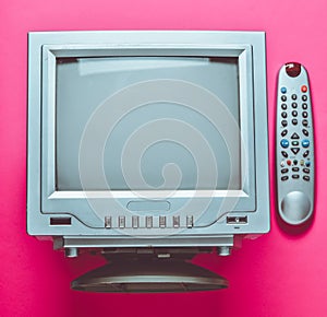 Retro tv top view on pink background.