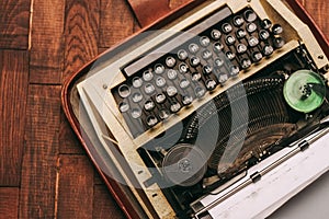 retro typewriter with keys letters wooden background white sheet of paper newspaper