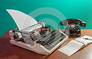 A retro typewriter and an old telephone are on the table, along with a checkbook and an ink pen