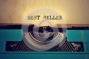 Retro typewritter and text best seller written with it photo