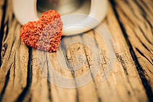 Retro valentine heart on old wood background.