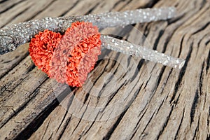 Retro valentine heart on old wood background.