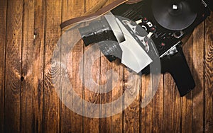 Retro videocamera on wooden boards background