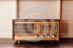 Retro vinatge radio Antique radio on white wooden background