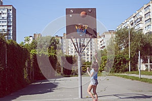 Retro Vintage Basketball Game. Girl on a basketball court.