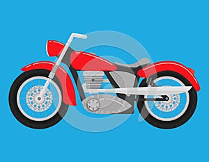Retro vintage classical motorcycle of red color. Two-wheeled vehicle.