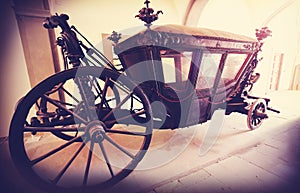 Retro vintage filtered picture of an old wooden carriage.