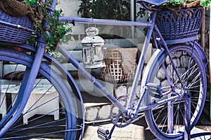 Retro Vintage Lavender Bicycle With Basket Of Flowers On City Street