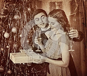 Retro vintage portrait of couple Christmas party. Black and white .