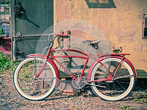 Retro vintage red bicycle. Old charming bicycle concept.