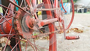 Retro vintage red bike close up. An old charming concept of a classic abandoned bike