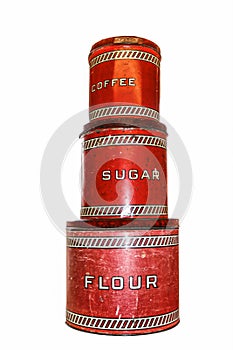 Retro vintage red worn kitchen canisters in a stack - flour - sugar - coffee - isolated on white