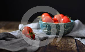 Retro vintage shot of tomatoes and vegetables on wooden table
