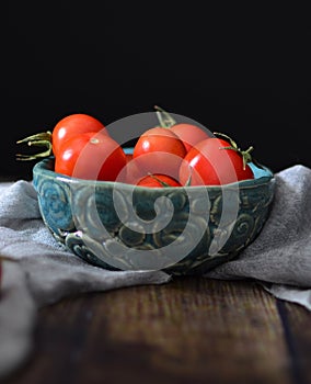 Retro vintage shot of tomatoes and vegetables on wooden table