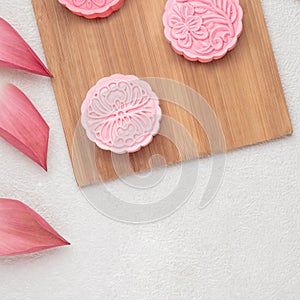 Retro vintage style Chinese mid autumn festival foods. Traditional mooncakes on table setting