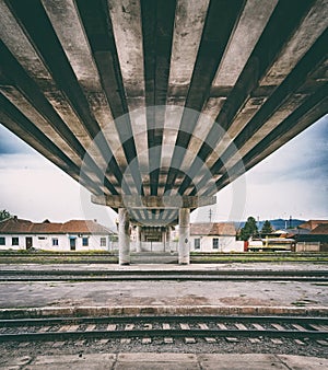 Retro vintage technology, old train tracks under the bridge, grunge background