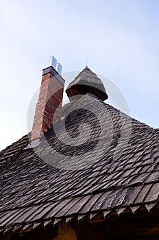 Retro vintage wooden roof new red brick chimney