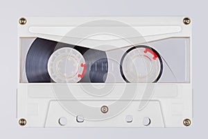 Retro white transparent audio tape isolated on white background.