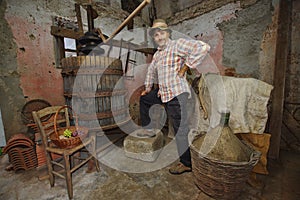 Retro winemaker in a cellar