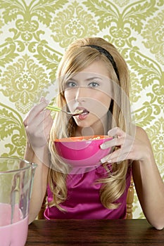 Retro woman breakfast eating corn flakes